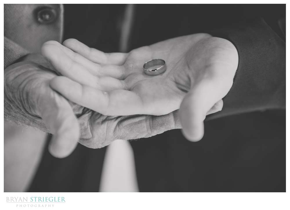 Holding wedding rings with grandfather